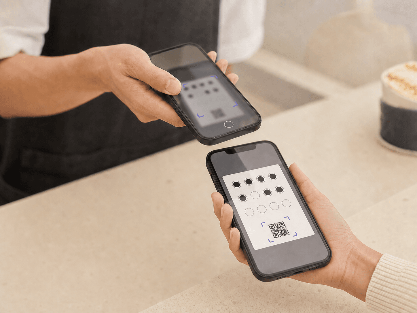 Staff member scanning a customer's digital loyalty card