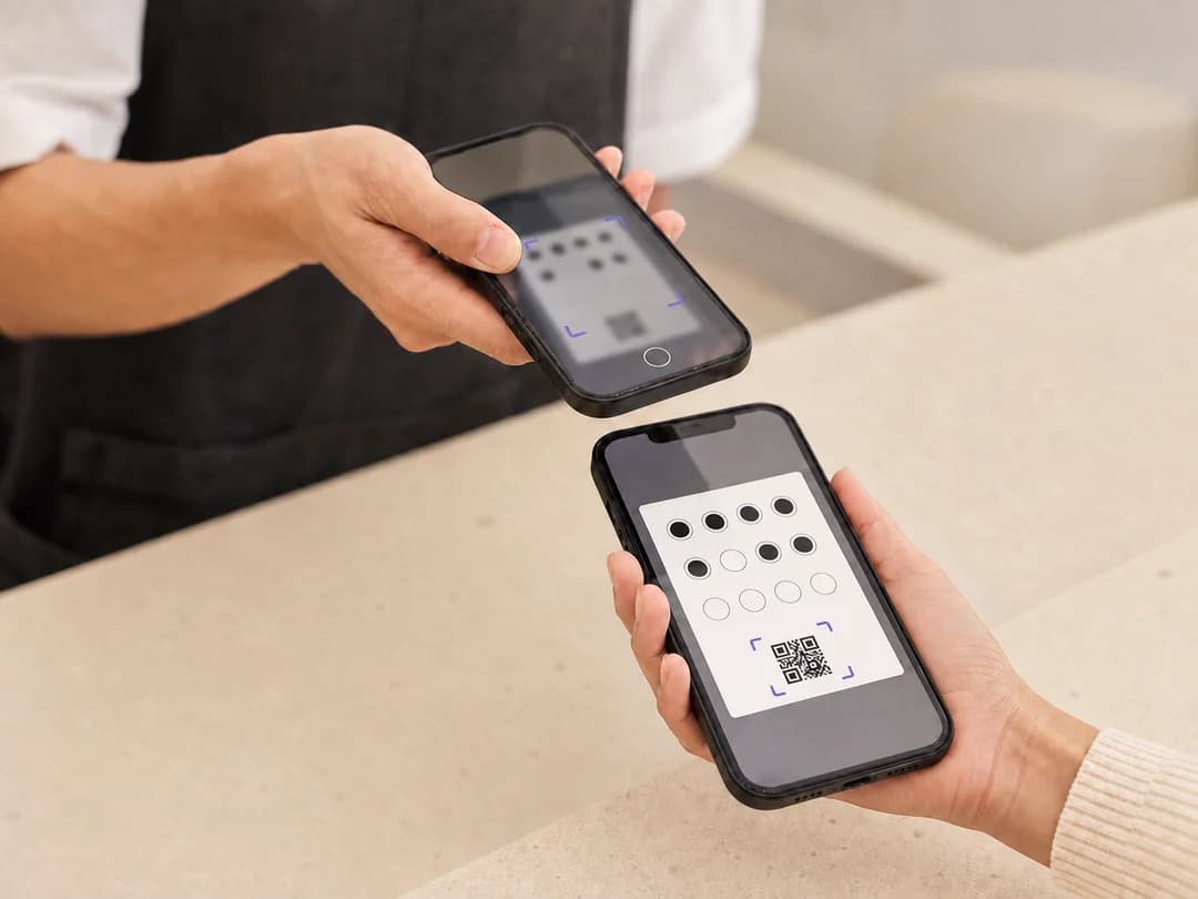 Staff member scanning a customer's digital loyalty card